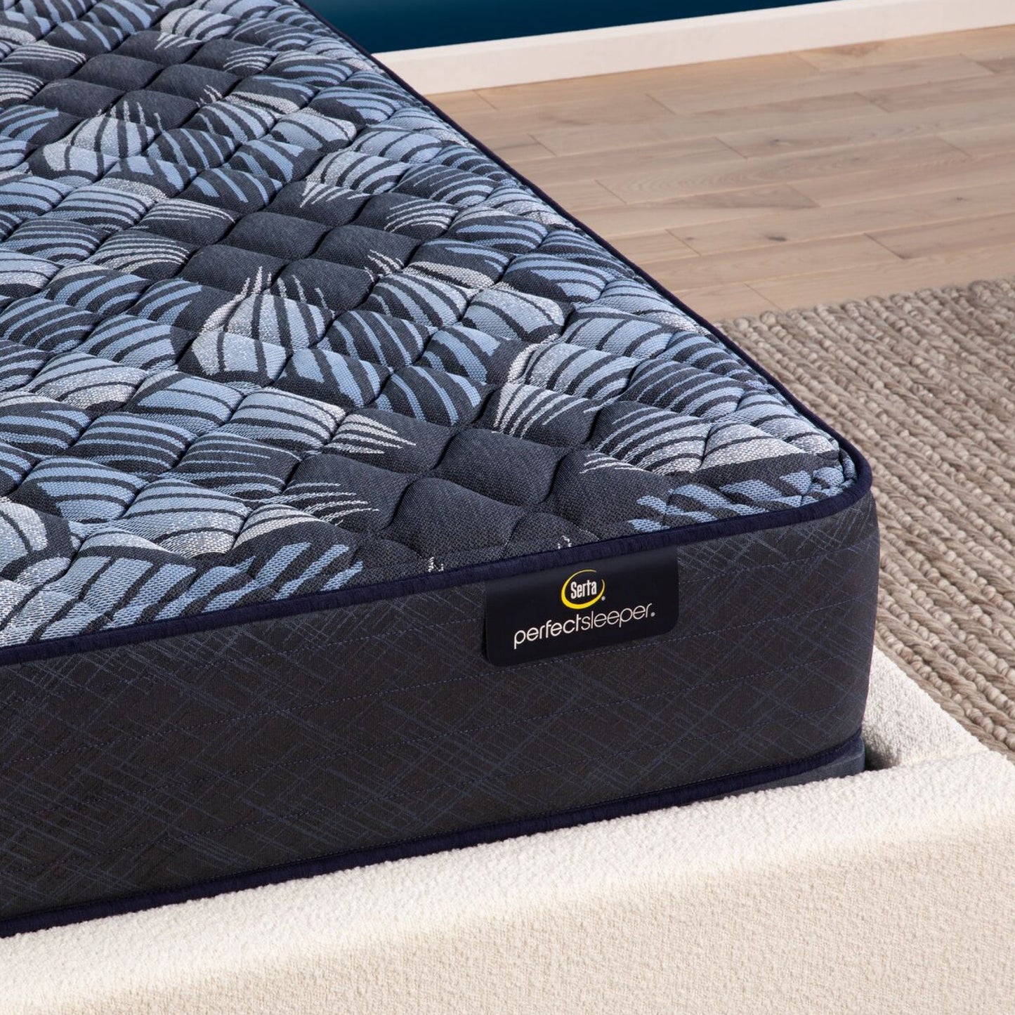 Corner view of the Serta Perfect Sleeper Sleep Excellence mattress in a bedroom | feel: Firm