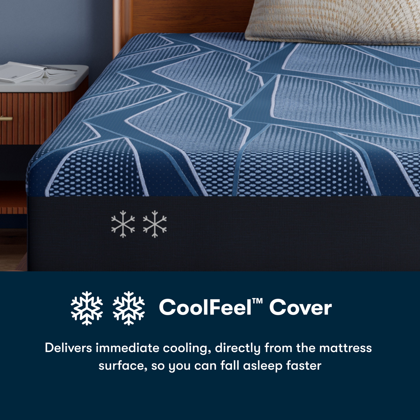 Blue iSeries® NXG Hybrid mattress cover with geometric pattern on a bed, featuring CoolFeel™ branding.