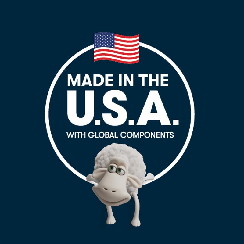 Person sleeping on a Serta memory foam mattress with a cutaway view showcasing its supportive, pressure-relieving foam layers, while a relaxed Serta sheep rests on top.