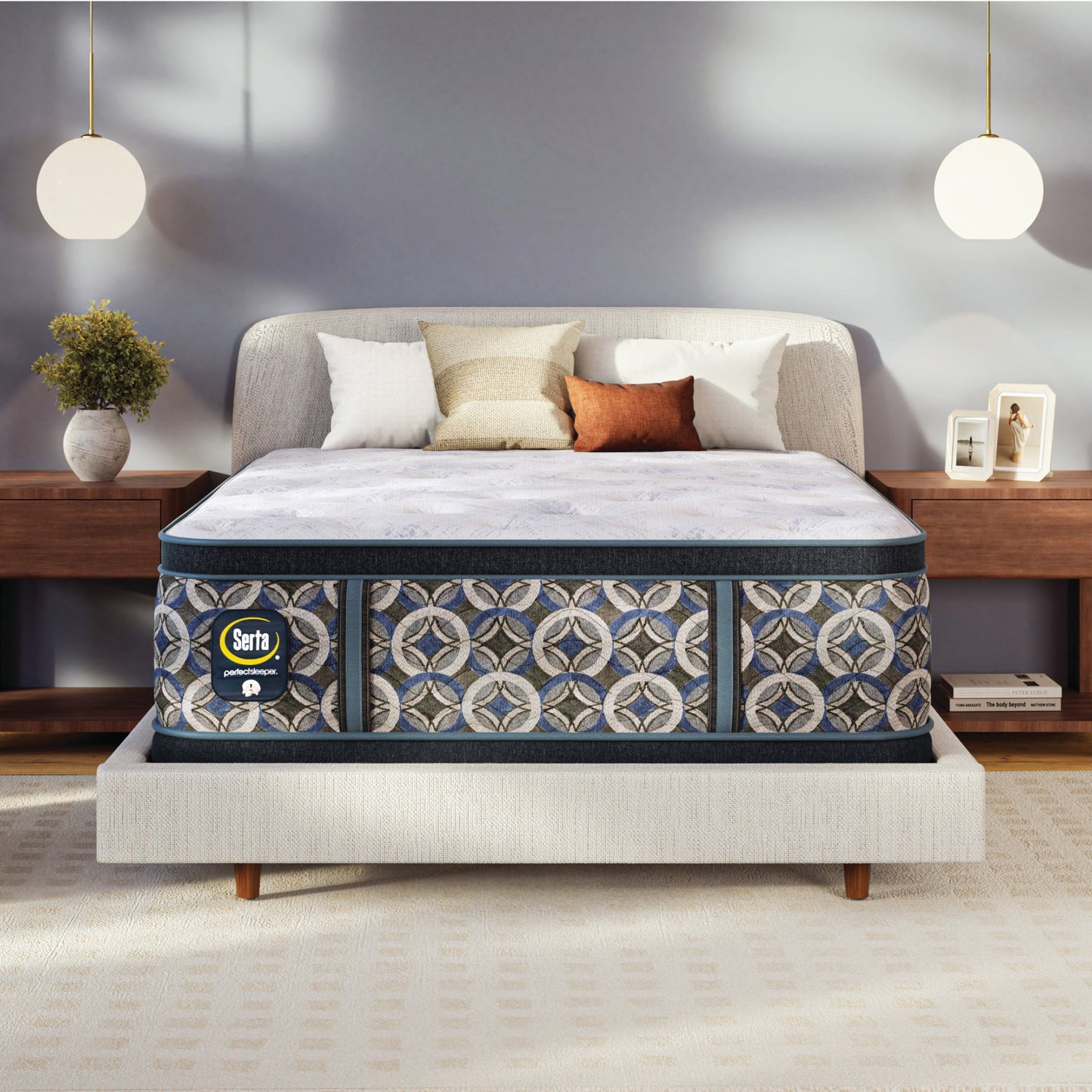 Serta perfect sleeper plush mattress on a bed in a bedroom setting with decor elements.