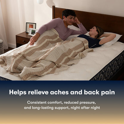 Couple lying in bed on a Serta perfect sleeper medium mattress under a striped blanket with text about back pain relief.