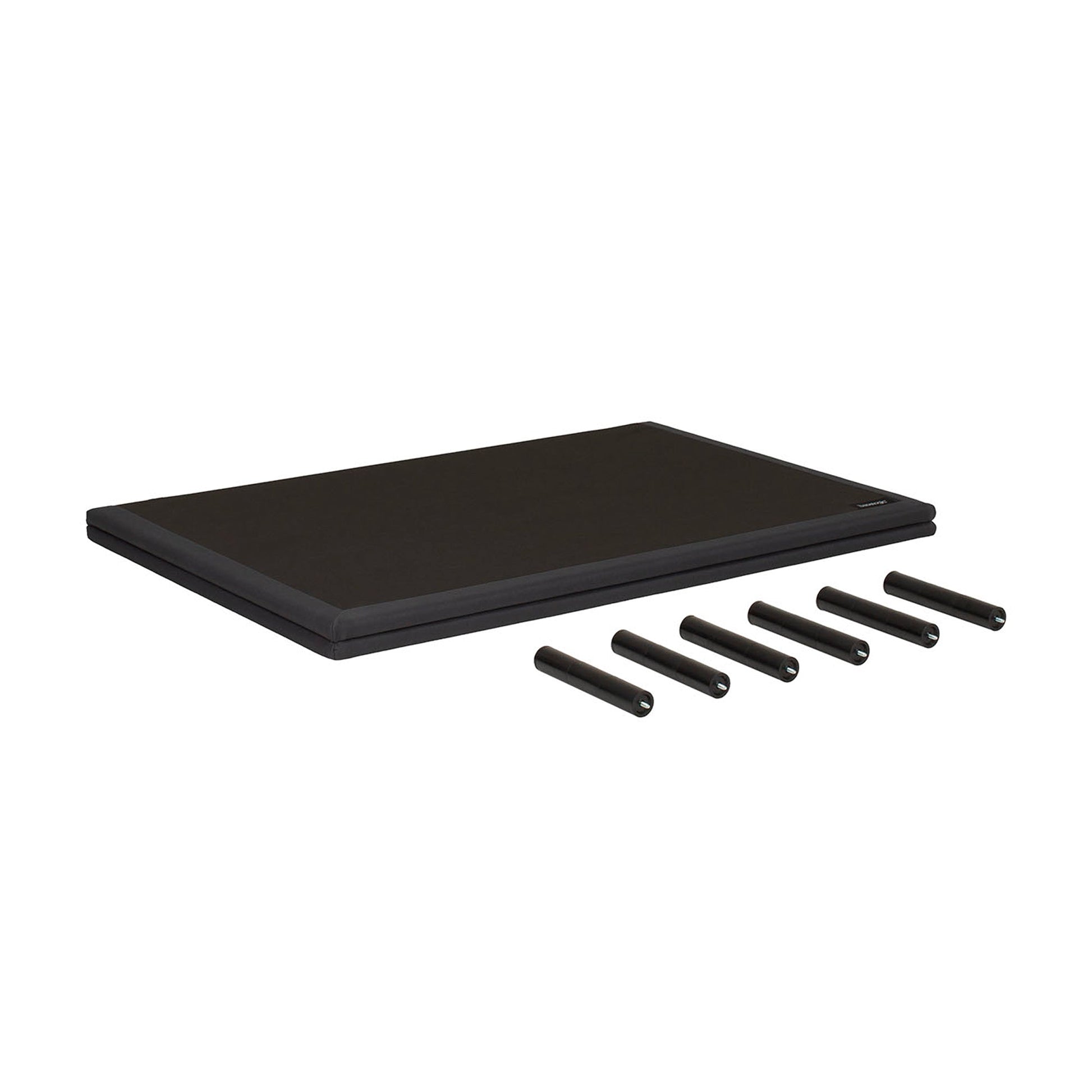 A black rectangular mat or pad shown on a plain white background, with five black cylindrical pieces placed in front of it.