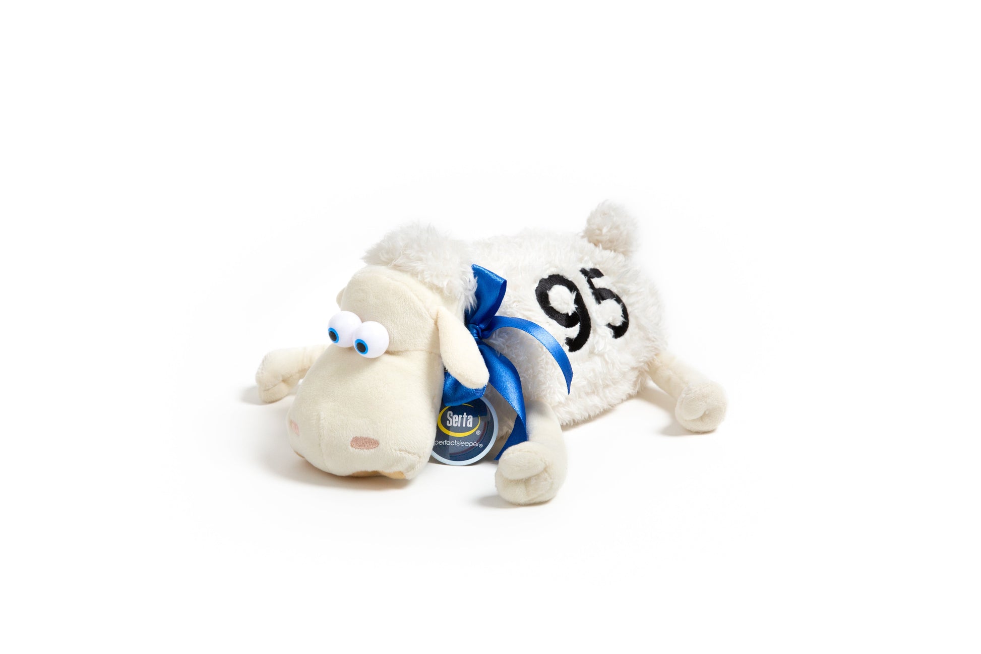 White Serta plush sheep toy with a blue collar and '95' tag on a white background